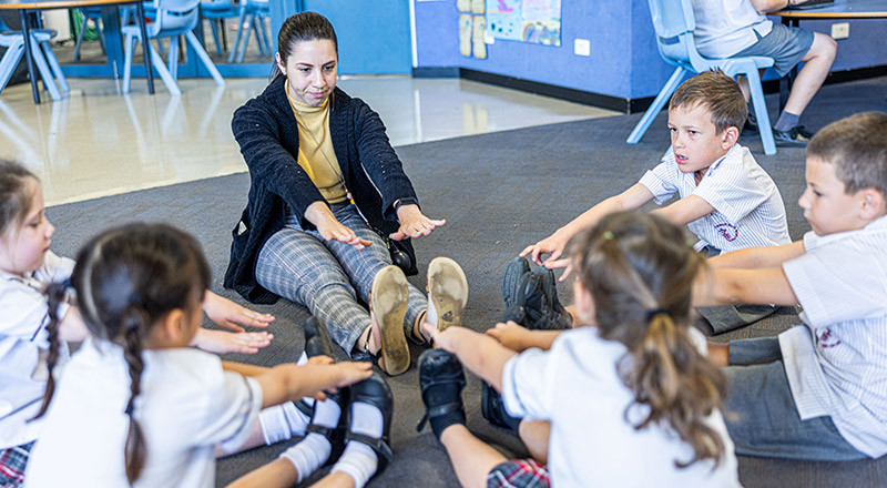 Teacher inspiring students at Holy Spirit Primary St Clair